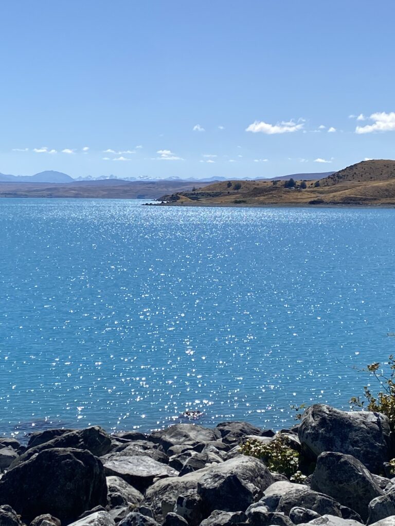 Light sparkling on the surface of lake Tekapo in New Zealand