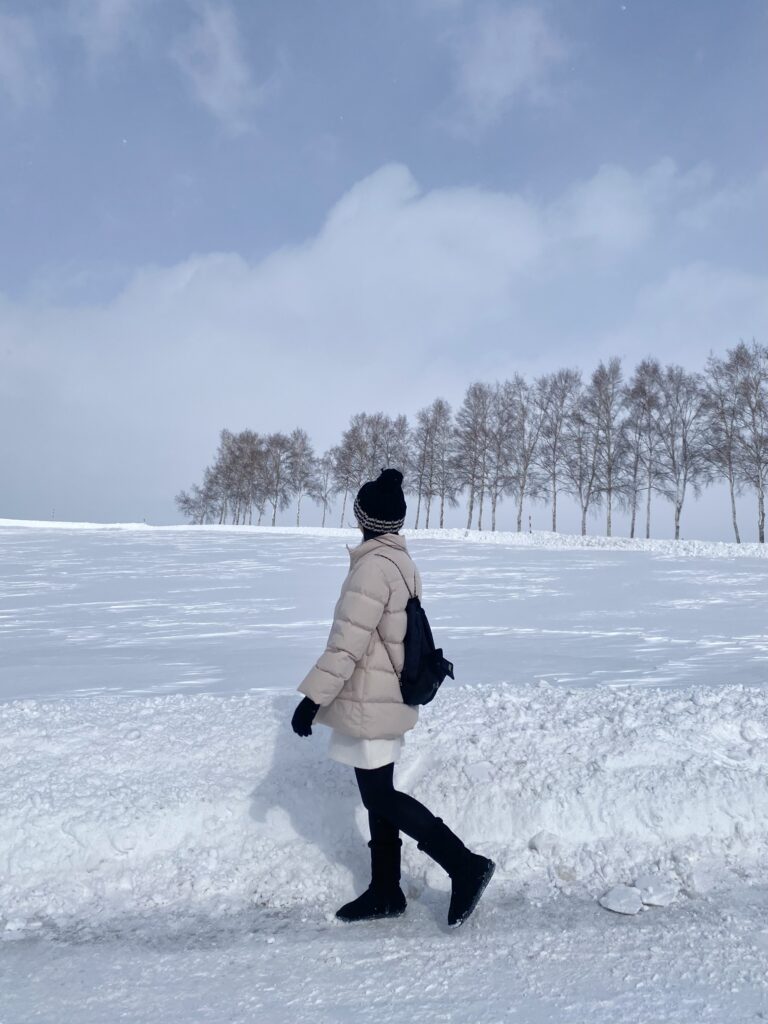 A woman walking along Patchwork Road